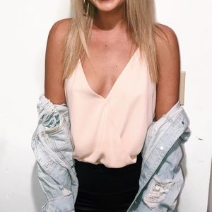 light pink loose bodysuit